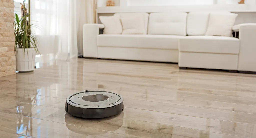 Robotporszívó képe munka közben nappaliban